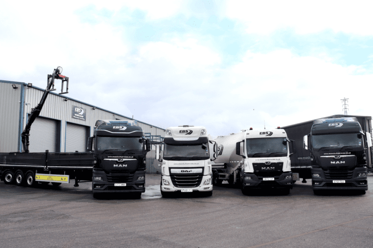 EBS Lorries Lined Up Outside Warehouse